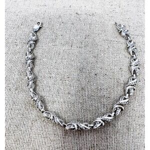 Sterling Silver Diamond Accent Infinity Twist Link Tennis Bracelet